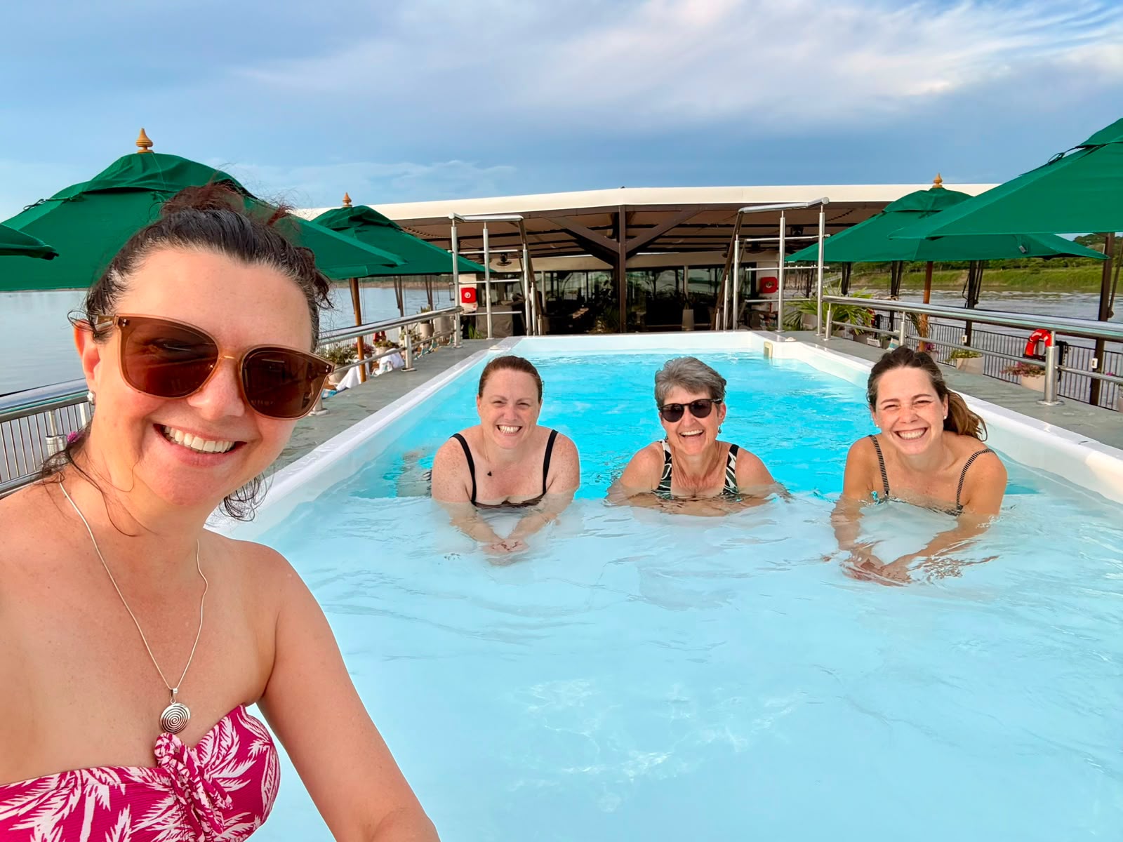 Guests enjoying the pool onboard the AmaMelodia on a Magdalena River cruise, Colombia.