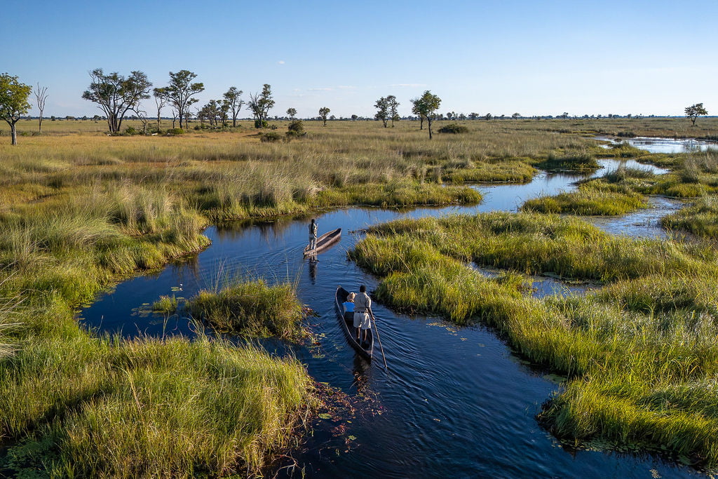An aerial view of guests on a mokoro safari in the Okavango Delta
