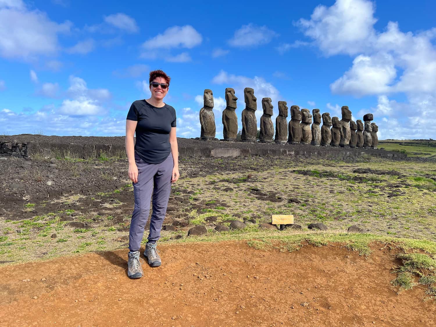 Tara stands before the moai of Ahu Tongariki.