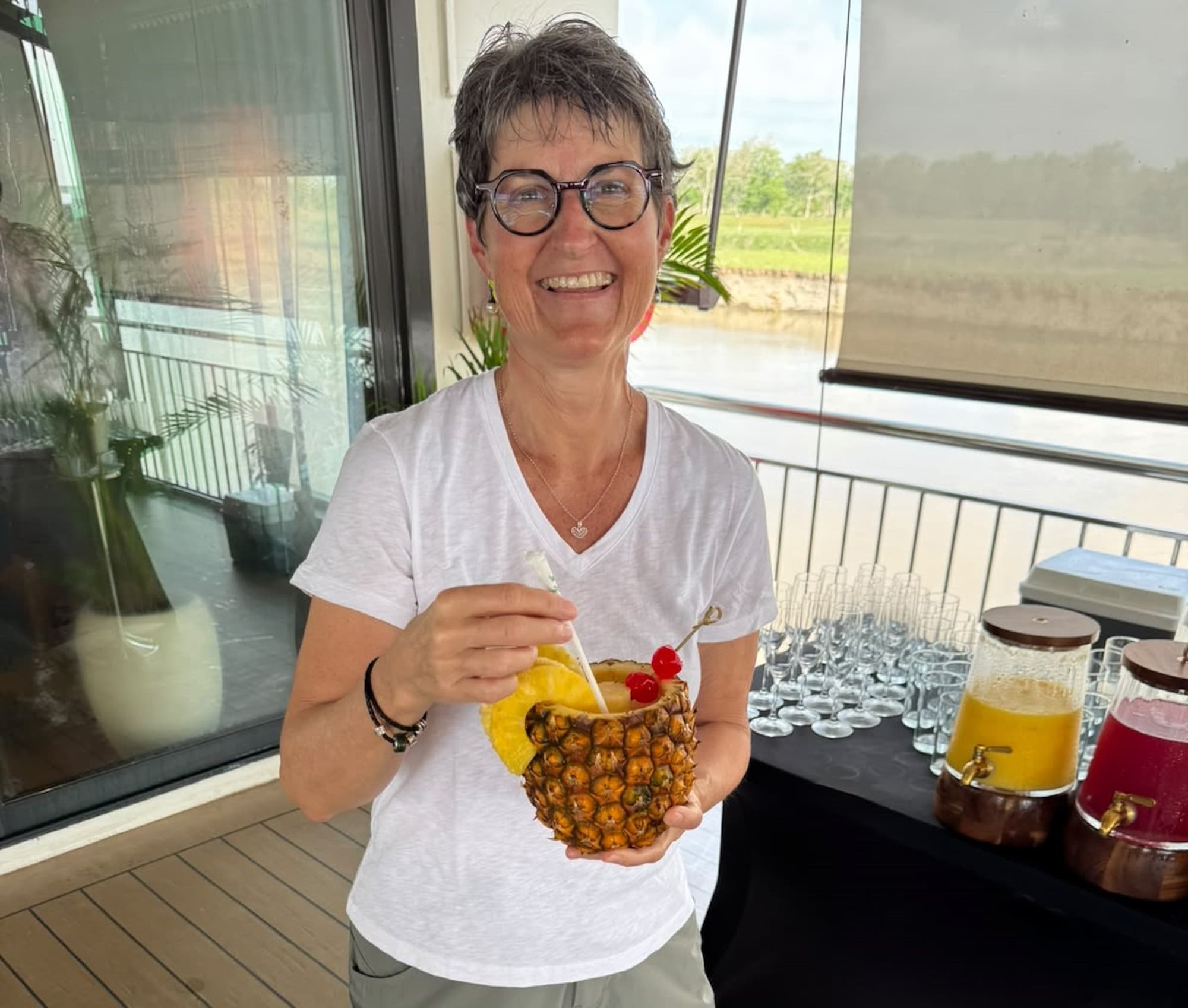 Pia enjoying a pineapple drink for breakfast on an AmaWaterways river cruise, Colombia.