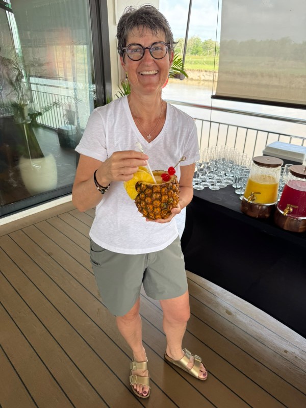 Pia enjoying a pineapple drink for breakfast on an AmaWaterways river cruise, Colombia.