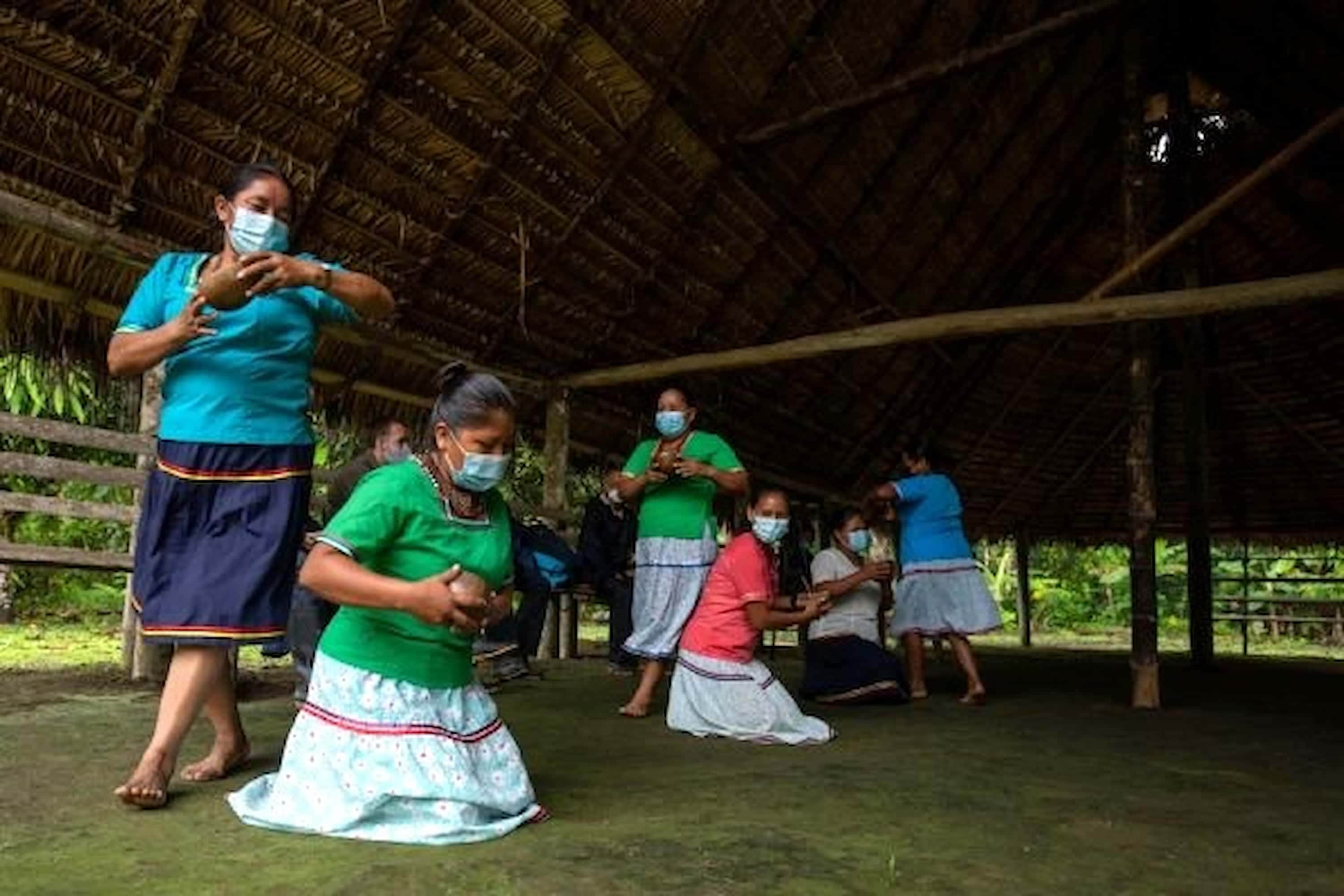 A group of women gracefully performing their ancestral cultural practices