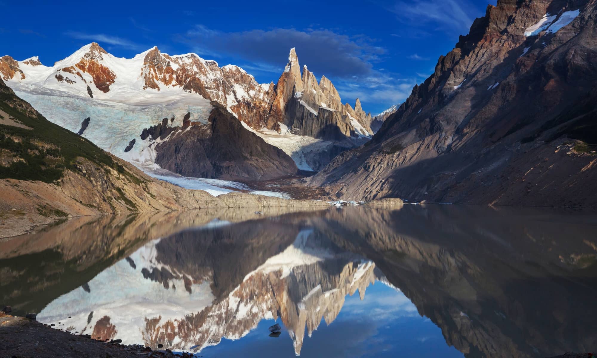 Snowy mountain reflected on glacial lake, El Chalten, Patagonia.