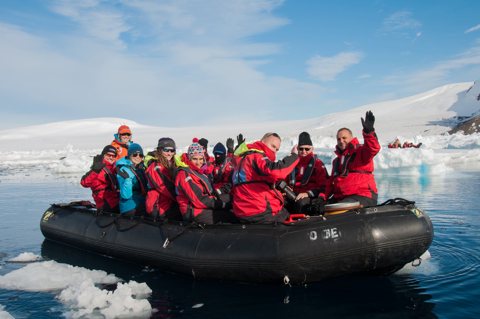 Polar expedition cruise passengers on an inflatable Zodiac.
