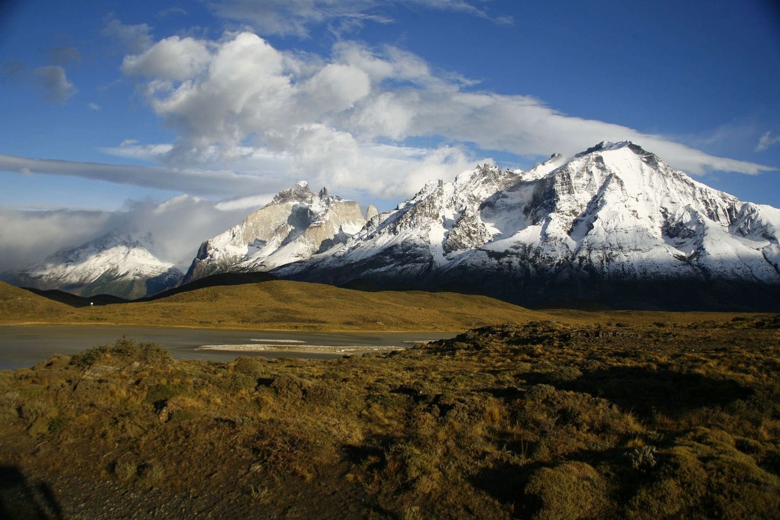 Mountain landscape in Patagonia, Chile, with lake and peaks in the background