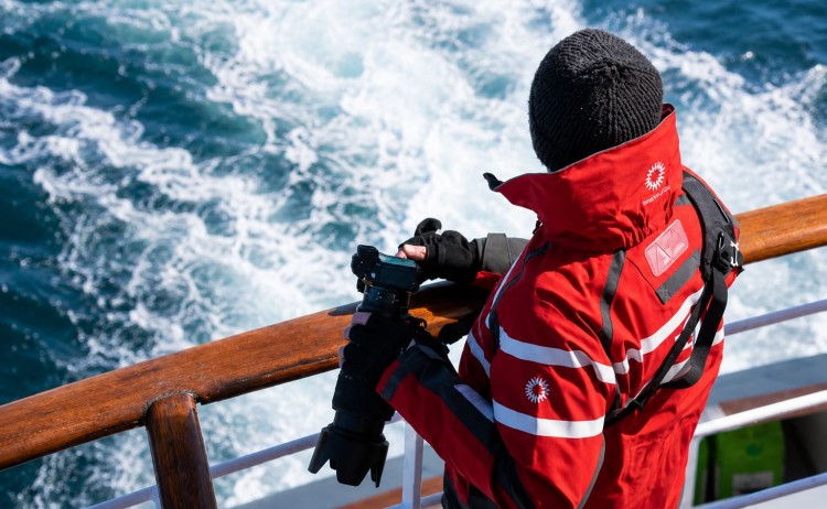 Antarctica springs to life man on ship deck