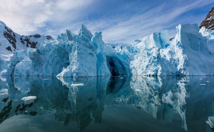 Antarcticas whale season towering glacier