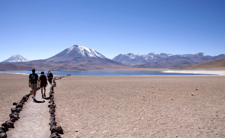 Atacama Desert tour a guided walk to along a desert rocky path