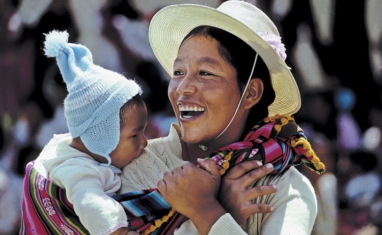 Signature tour, local woman carrying her baby
