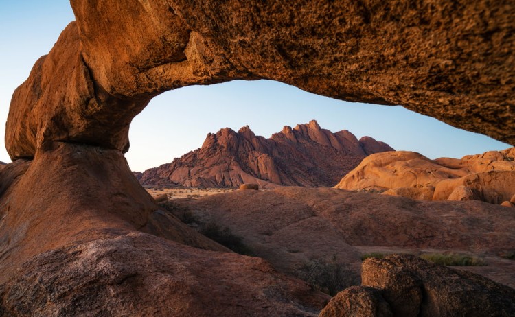 Cape town to Victoria falls adventure Rock arch and granite mountains at sunset in Spitzkoppe Damaraland Namib Desert Namibia