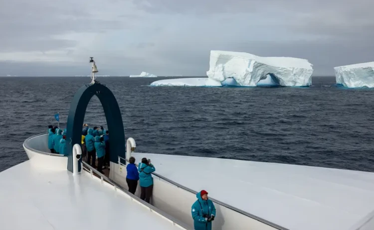 Antarctic wonders guest on ship deck