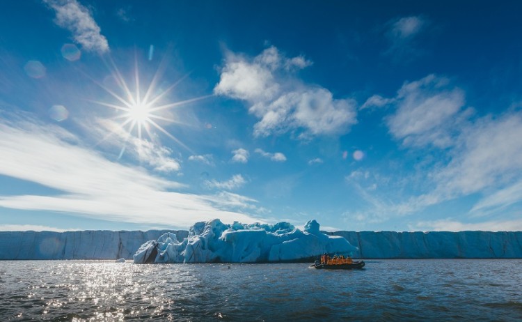 Svalbard in spring, zodiac beneath the Midnight Sun