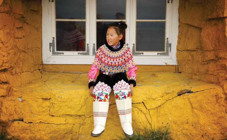 Greenlandic girl in windowMIchelle Valberg Greenland and wild labrador