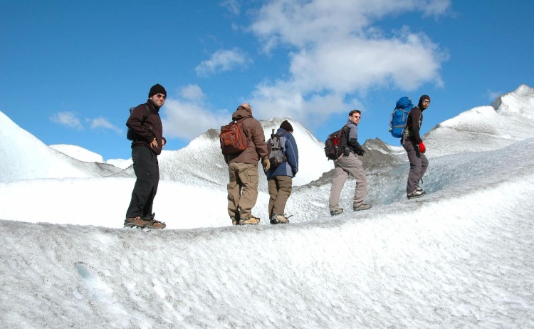 Hike adventure in El Chalten trekking along a snow covered ridge Argentina