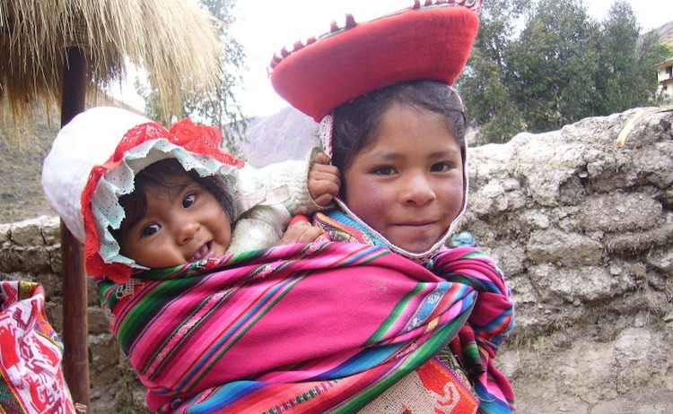 Mountain lodges in Peru young local in their traditional attire