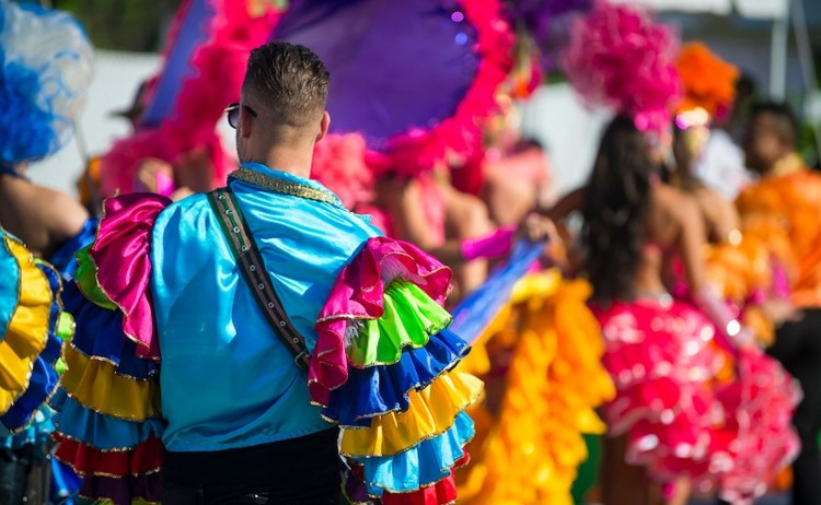 rio carnival package performers in vibrant multicolored costumes