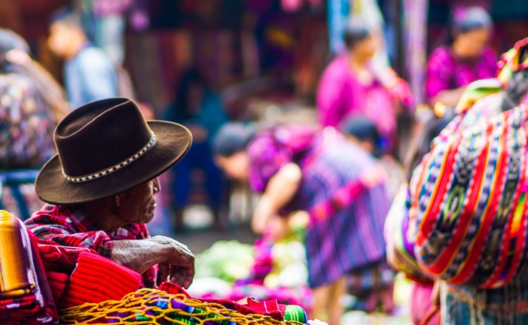 Guatemala tours view on old maya man on market in Chichicastenango