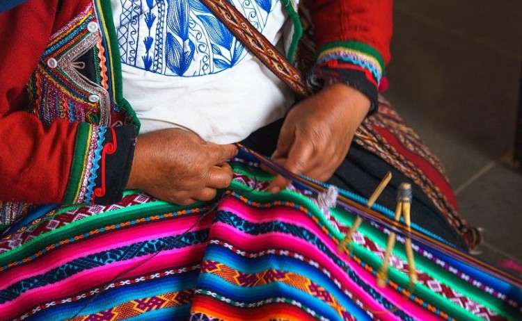 Signature Peru woman weaving textile