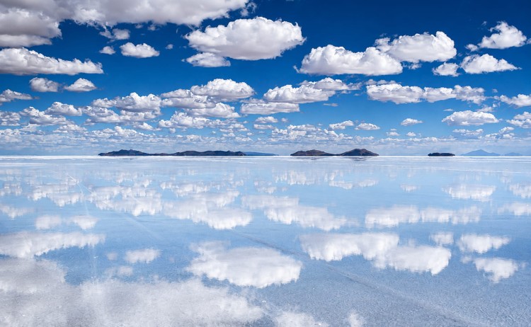Signature tour Salt flats with sky and clouds reflection