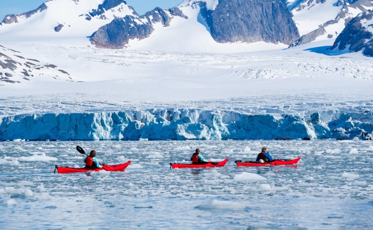 Realm of Ice wildlife Kayakers kayaking through ice along glacier Svalbard DivergentTravelers 1296