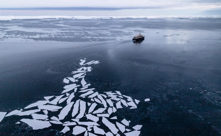 Unexplored Antarctica panoramic of Le Commandant charcot with ice floes