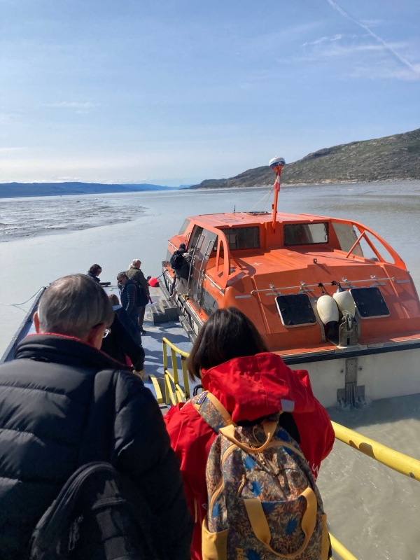 Passengers boarding a tender boat