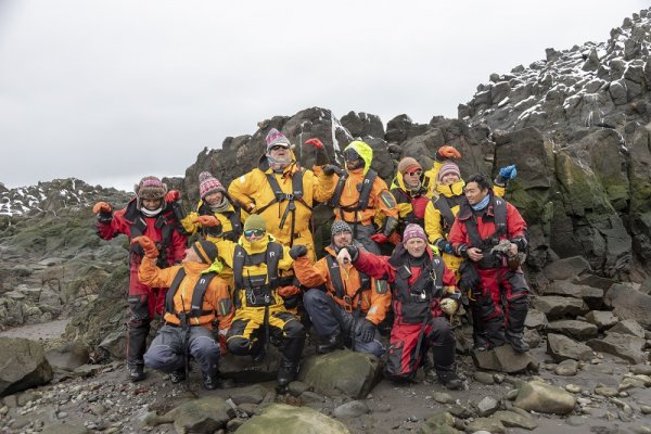 Hurtigruten expepdition team posing in Antarctica