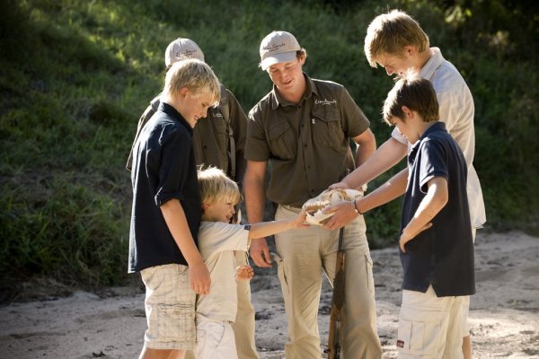 Family group looking at fossil