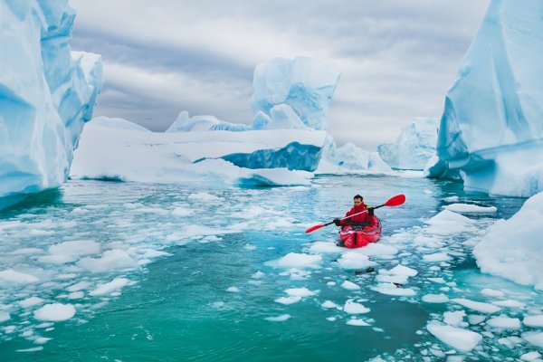 Kayaking between icebergs in Antarctica