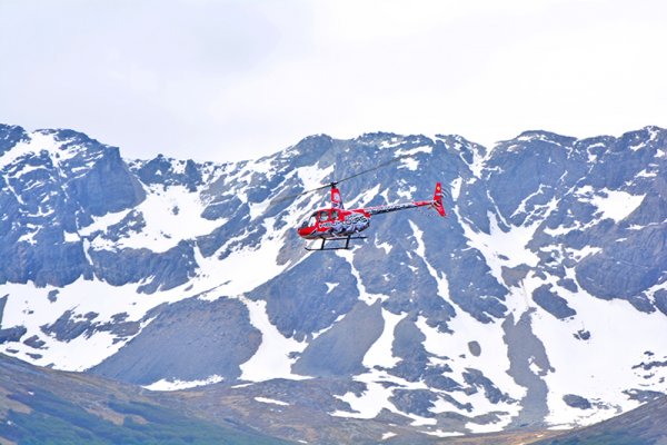 Tourist helicopter flying over the city of Ushuaia