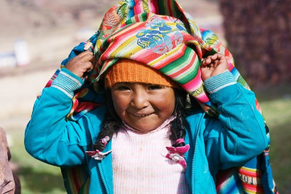 Peruvian kid playing on the sun 