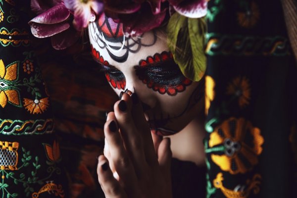 Girl with traditional sugar skull makeup