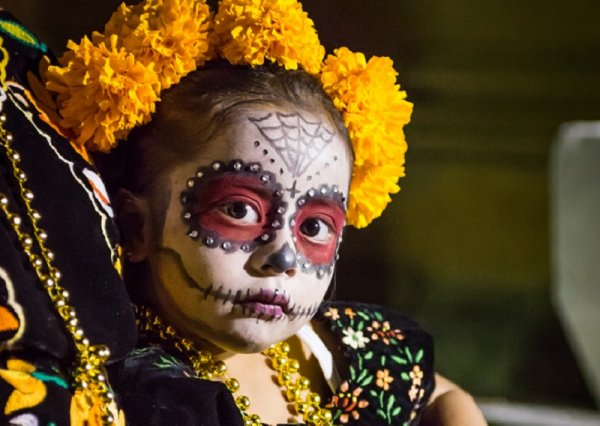 Little Calaca - Mexican girl in Day of the Dead makeup and costume