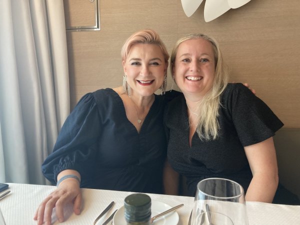 Two women smiling at camera