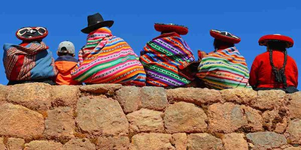 Ecuador's local Quechua ladies and a young boy in Inca Wall