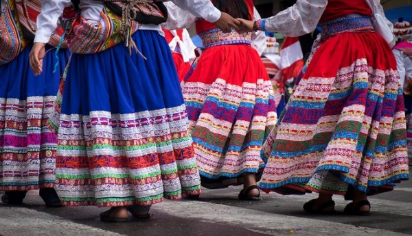 Women danding in traditional clothes in La Paz, Bolivia