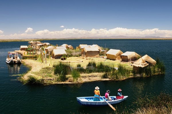 Indigenous people in the boat on Lake Titicaca in Peru