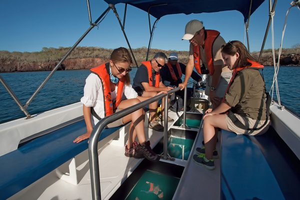 Passengers on a glass bottom boat, Galapagos Islands