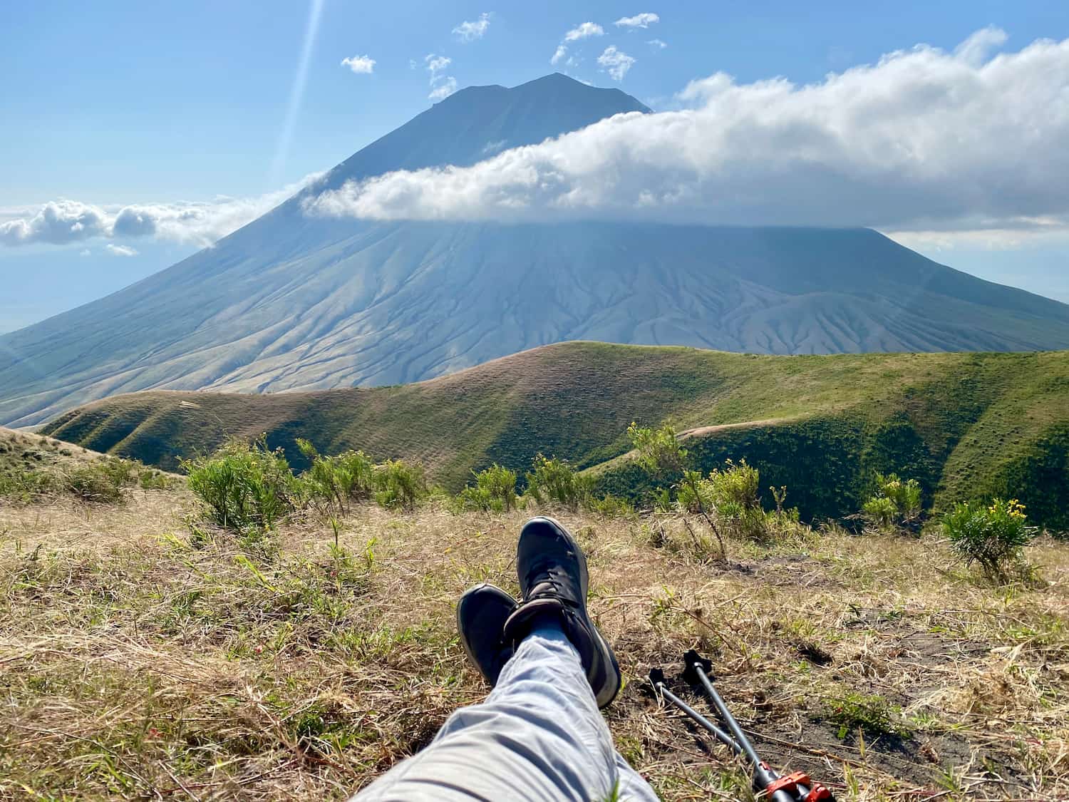 A hiker resting with Mount Kilimanjaro in the background