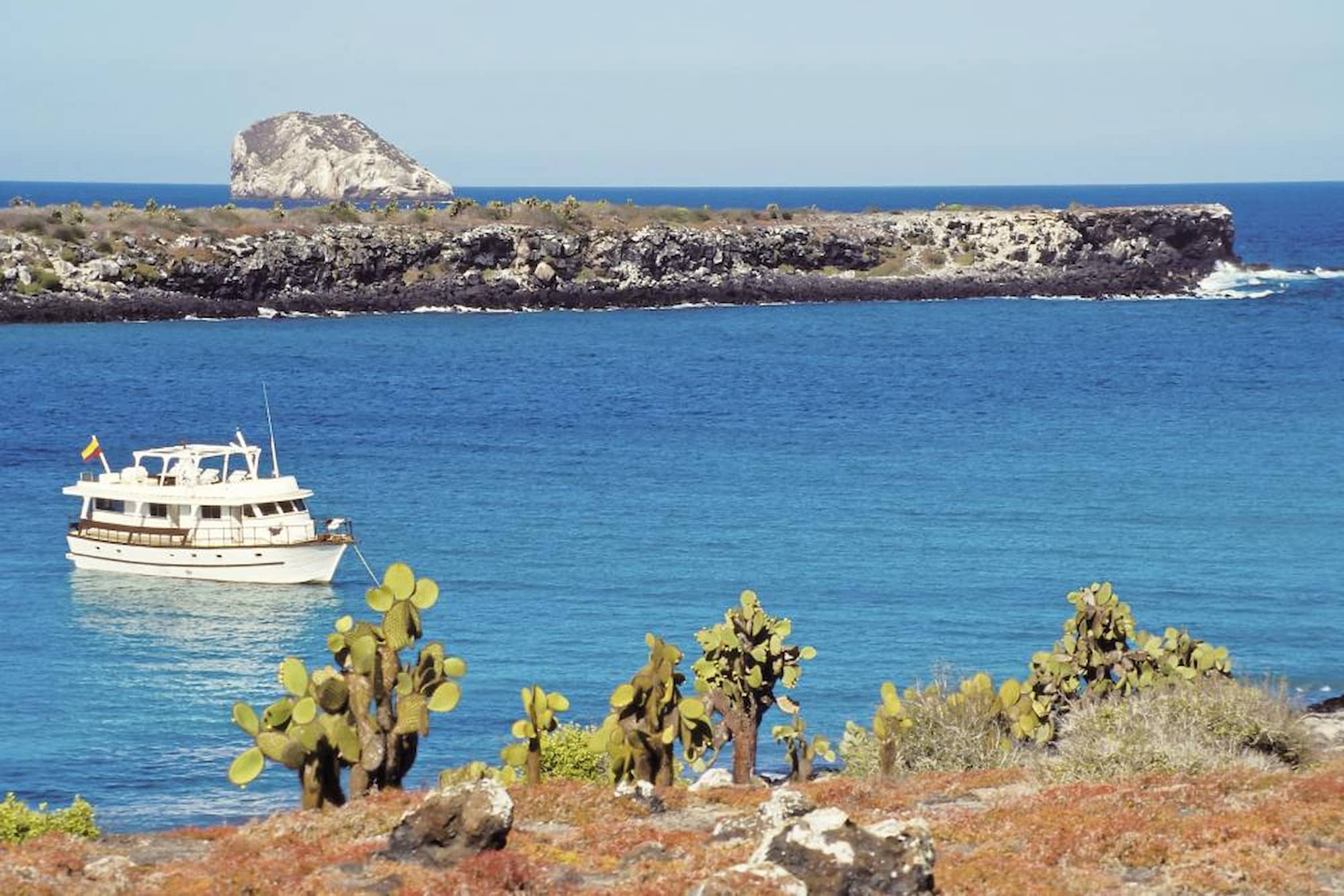 A small ship sailing the pristine waters of the Galápagos
