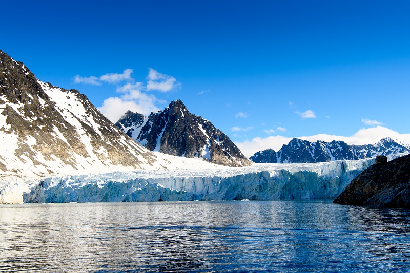 Glacier calving into a fjord, Svalbard, Arctic