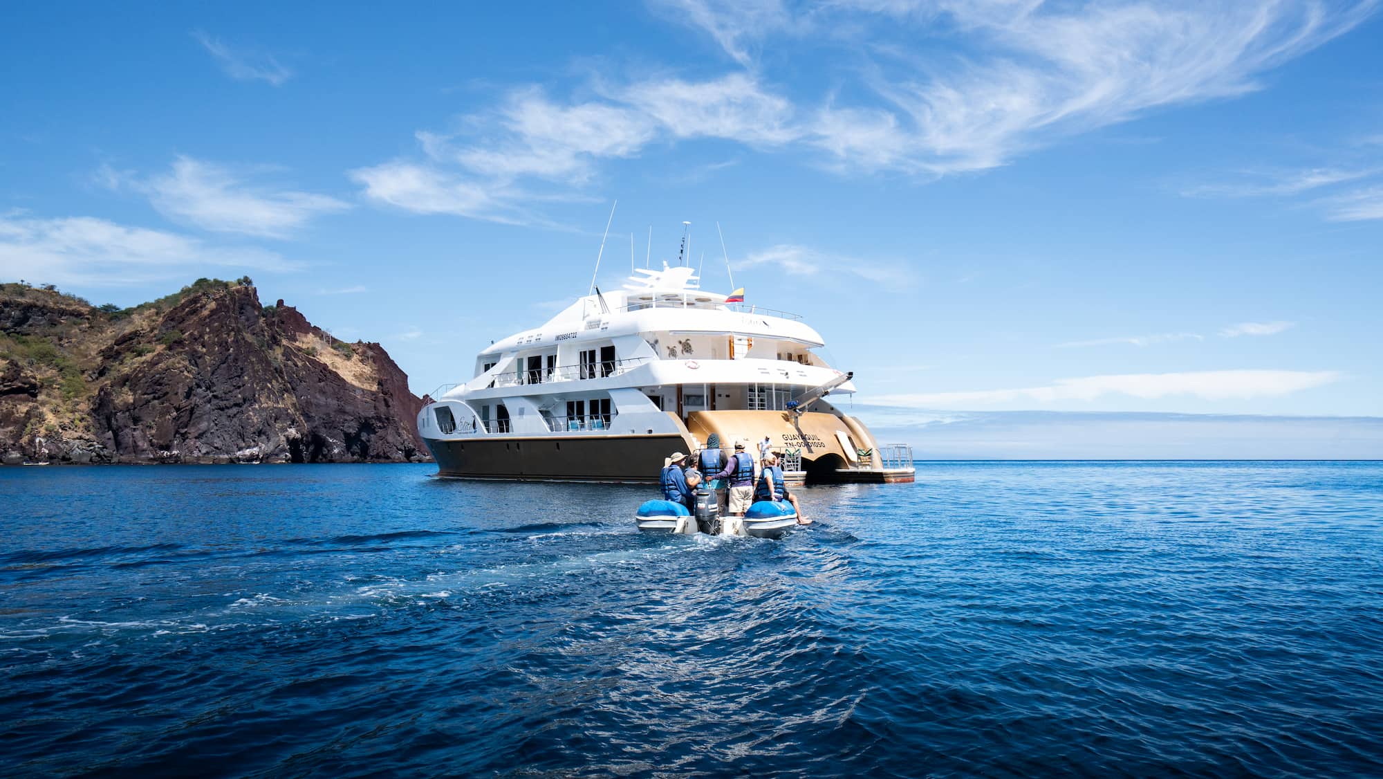 Galapagos cruise passengers returning onboard after exploring on land.