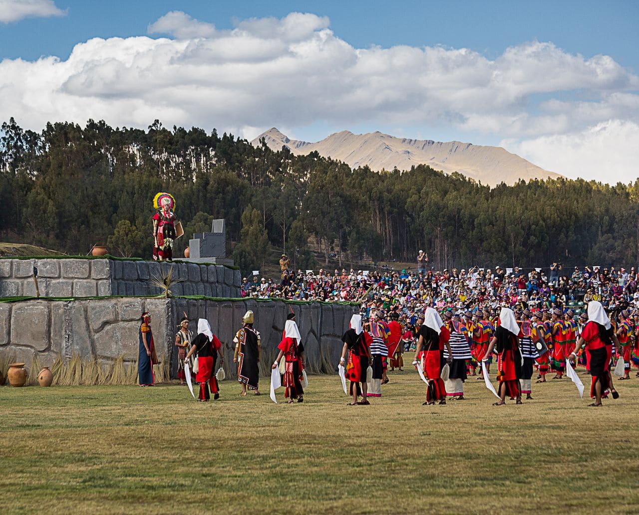 Performers in traditional Inca costumes reenact the Inti Raymi festival at Sacsayhuamán in Cusco, Peru
