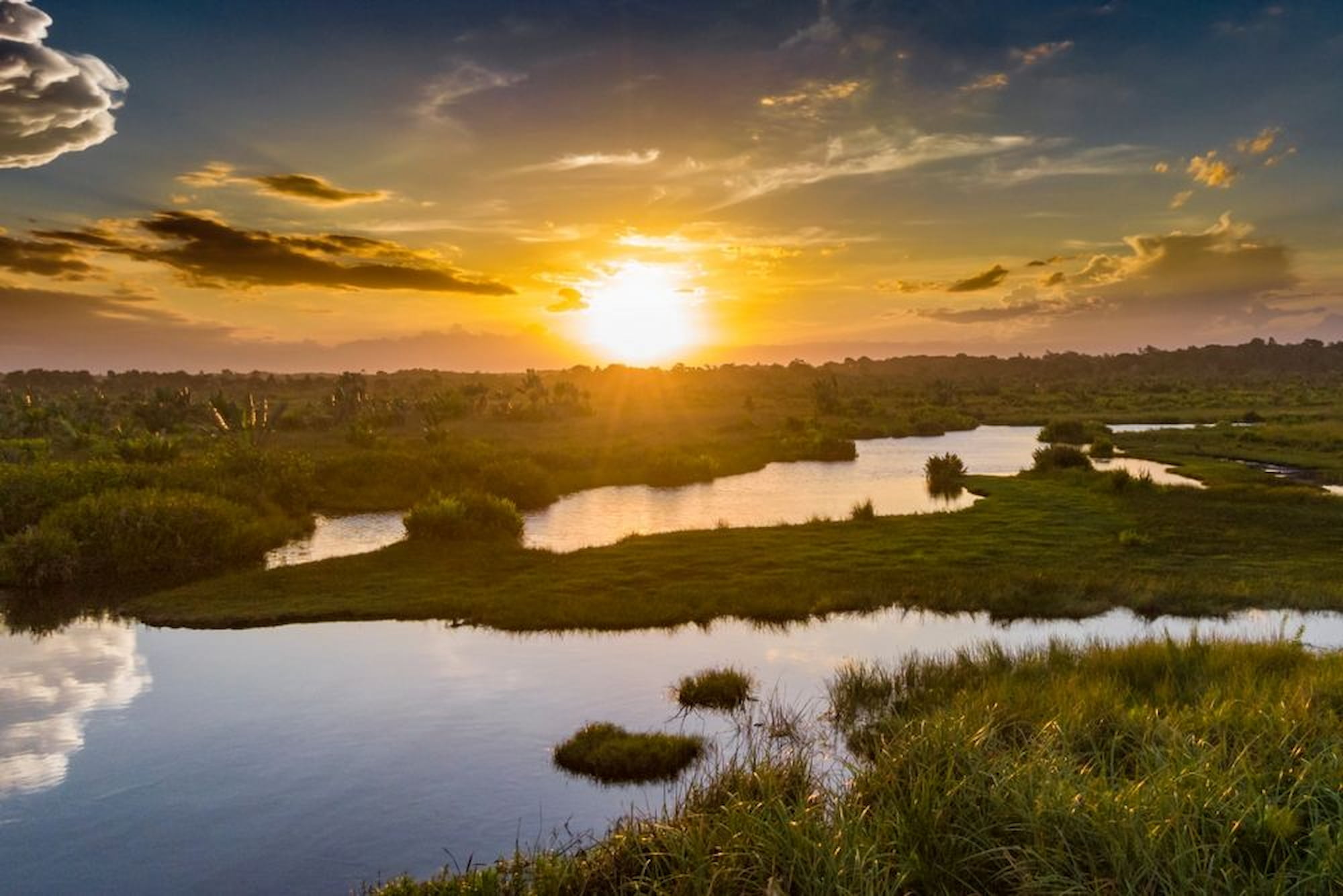 Golden waters, peaceful skies—Pangalanes Canal at sunset.