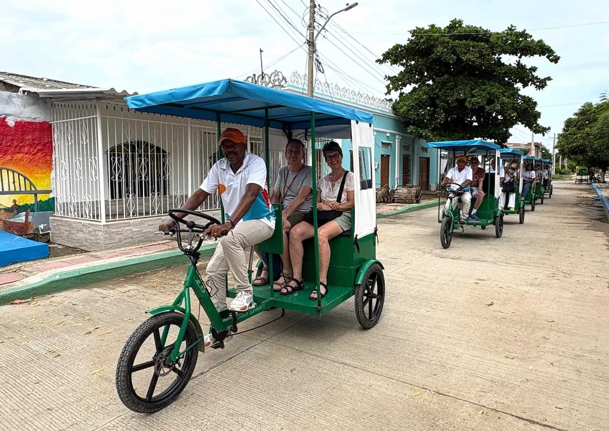 Tourists on a paola bicycle taxi in Calamar, Bolívar, Colombia