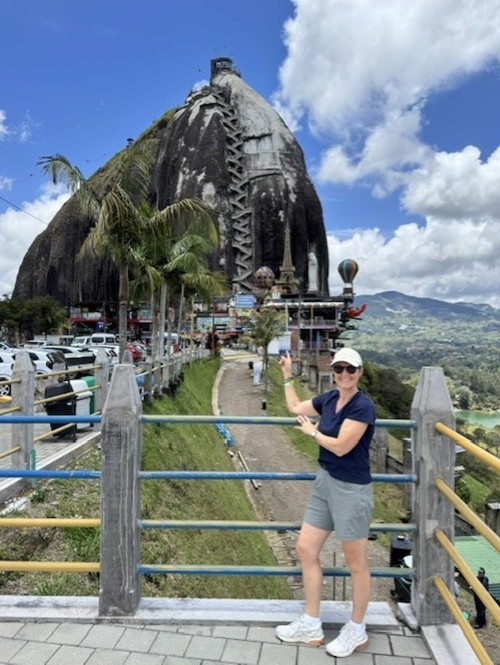 Tourist pointing to La Piedra del Peñol, Antioquia, Colombia.