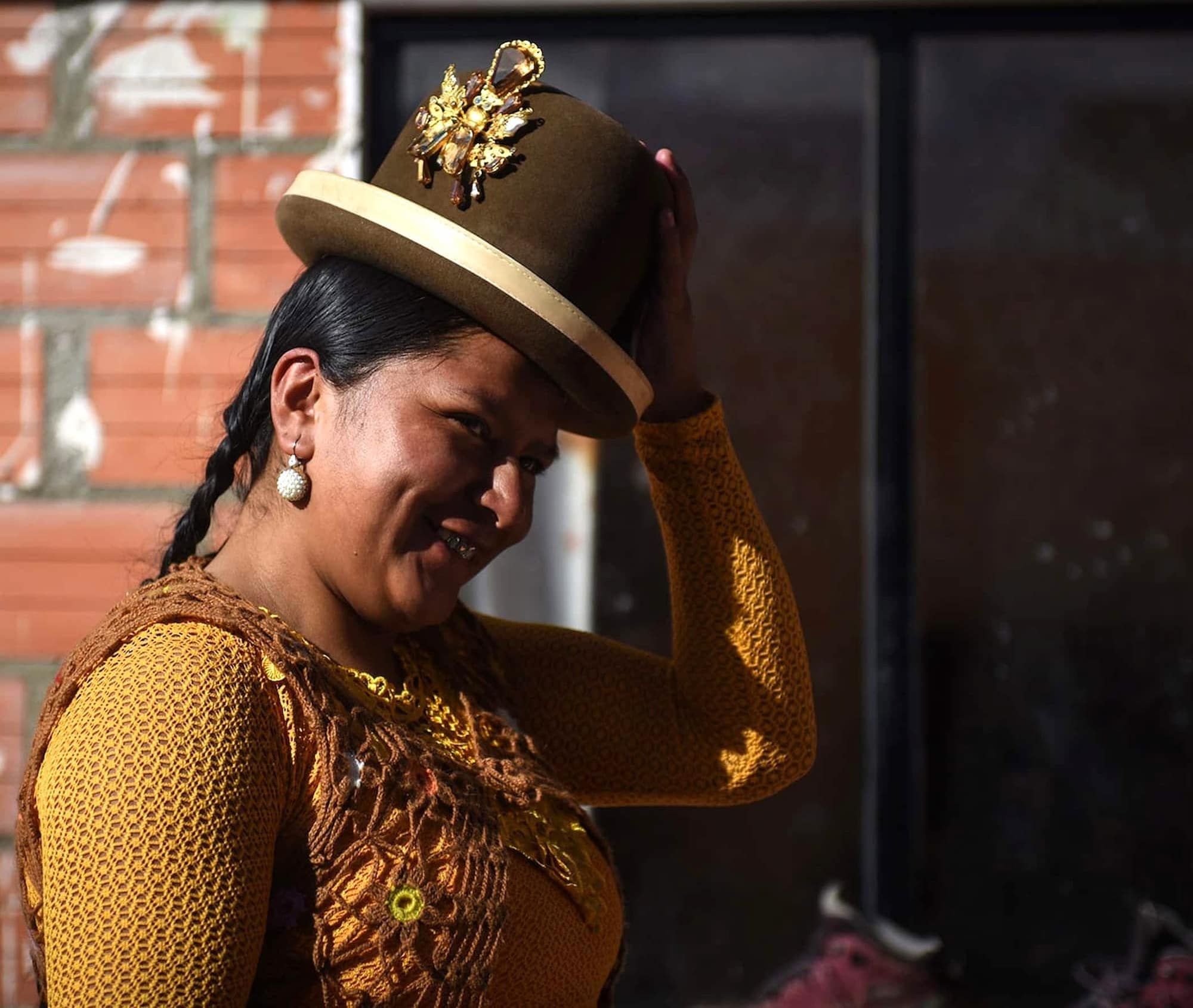 Woman wearing traditional bowler hat or Borsalino. Woman wearing traditional bowler hat or Borsalino.