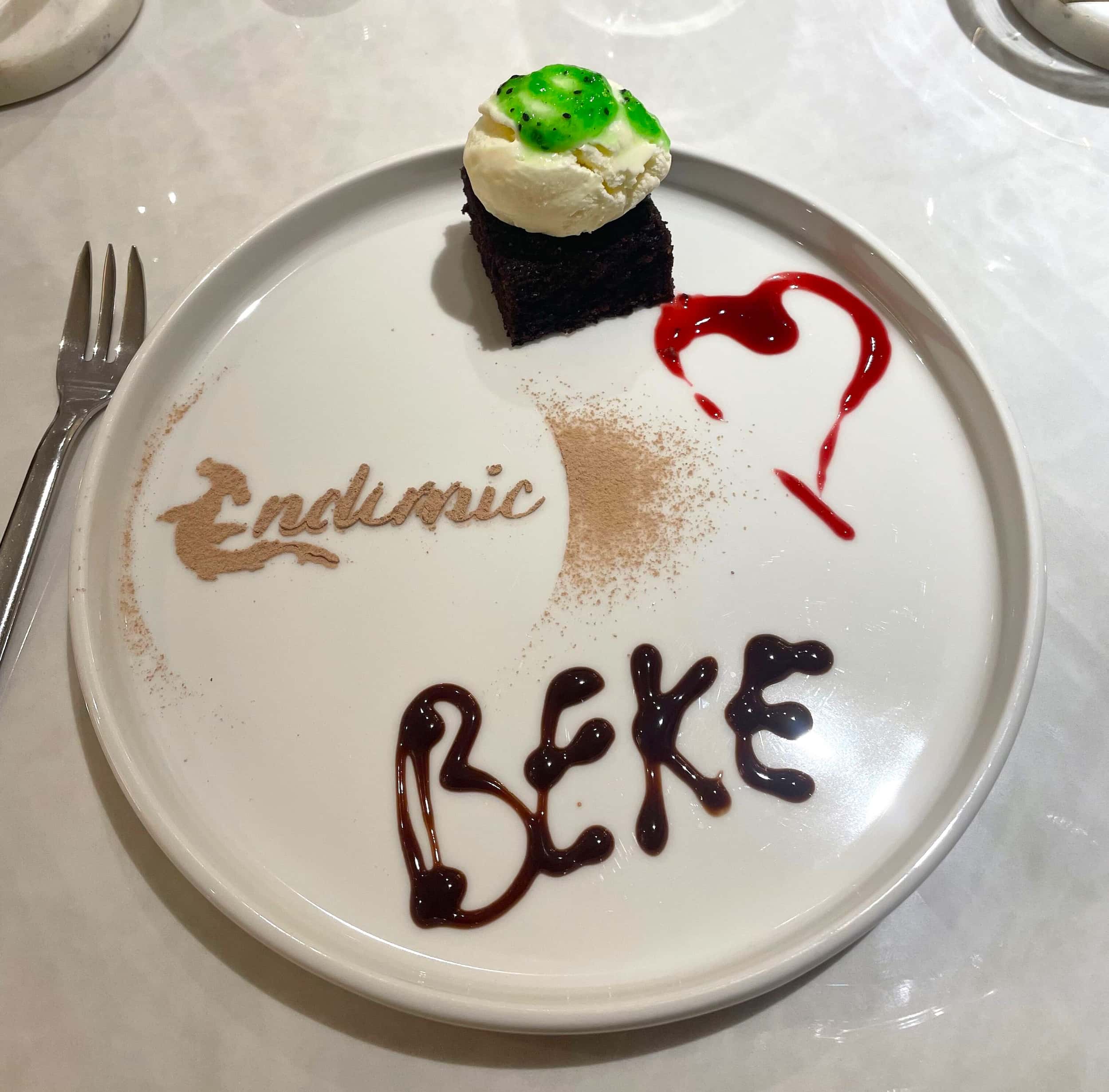 Personalised dessert plate with Beke's name written in chocolate sauce aboard M/C Endemic Galapagos cruise