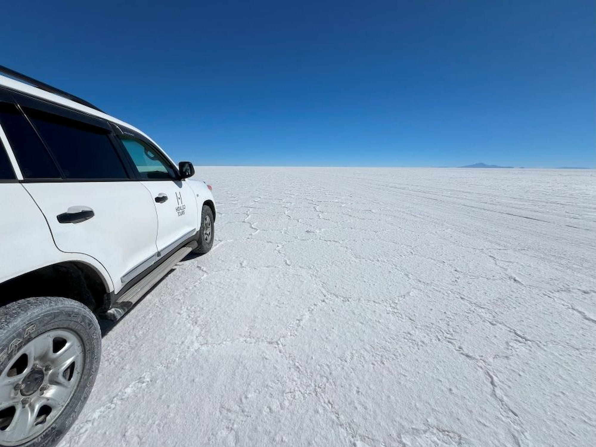A car adventure on the vast Uyuni Salt Flats. A car adventure on the vast Uyuni Salt Flats.