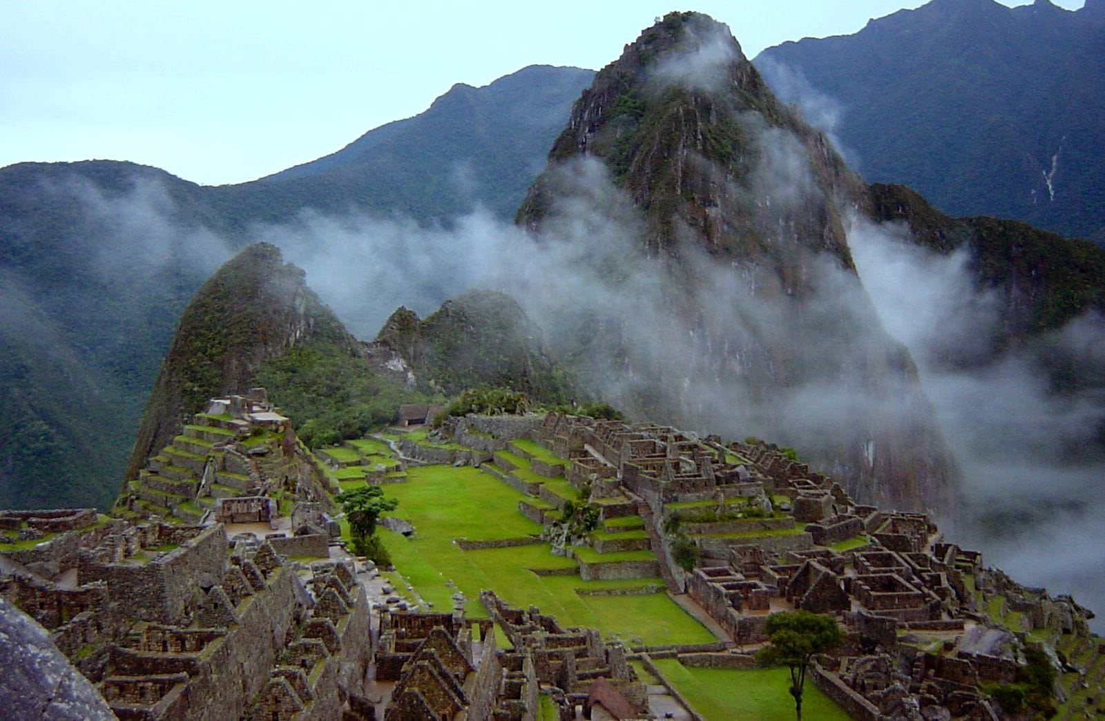 Panoramic photo of Machu Picchu, Peru, showing Inca terraces and Huayna Picchu. Panoramic photo of Machu Picchu, Peru, showing Inca terraces and Huayna Picchu.